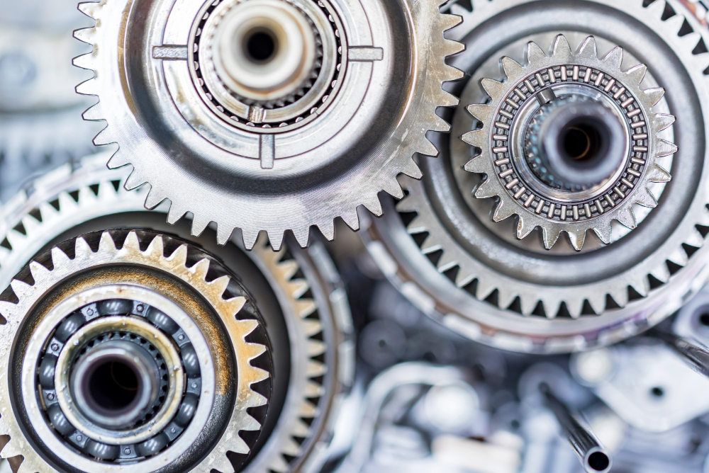 Rouages industriels illustrant l’optimisation ERP des ventes mécaniques
