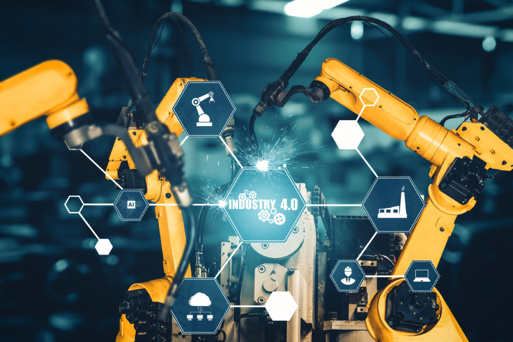 Bras robotisés en usine illustrant l'intégration de Six Sigma et SPC dans un environnement ERP Industrie 4.0