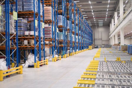 warehouse-storage-interior-with-shelves-loaded-with-goods-min Gestion de stock dans une l'entrepôt pour le logiciel ERP Open-Prod qui assure une traçabilité sur l'ensemble des flux.